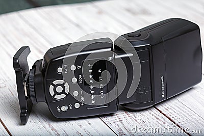 Photo camera flash or speedlite Stock Photo